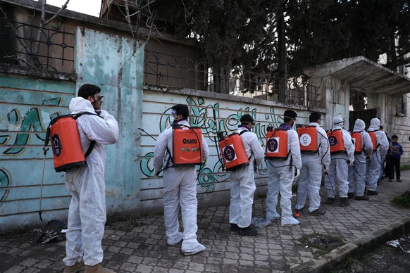 epa08313219 Volunteers from Violet Organization prepare to disinfect shelters as precautionary against coronavirus in Idlib, Syria, 20 March 2020 (issued 22 March 2020). EPA/YAHYA NEMAH