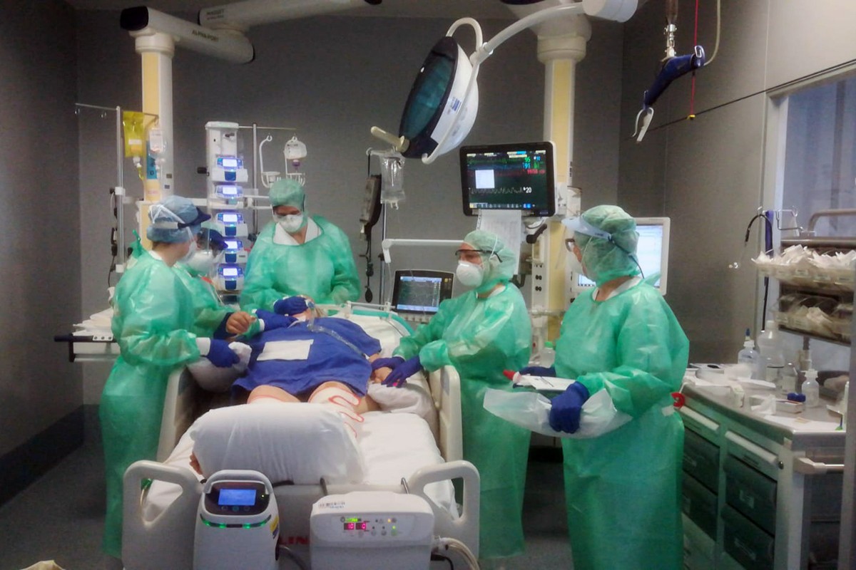 Medical staff assist a patient in the Intensive Care Unit of the Bergamo Papa Giovanni XXIII hospital, Italy, Tuesday, March 17, 2020. For most people, the new coronavirus causes only mild or moderate ...