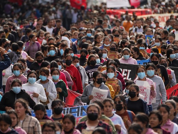 Relatives and classmates of the missing 43 Ayotzinapa college students and supporters march in Mexico City, Monday, Sept. 26, 2022, on the day of the anniversary of the disappearance of the students i ...