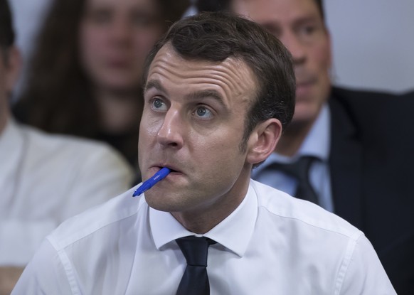 epa07343858 French President Emmanuel Macron listens during a meeting with mayors from suburbs around Paris, as part of the &#039;national debate&#039;, in Courcouronnes, outside Paris, France, 04 Feb ...