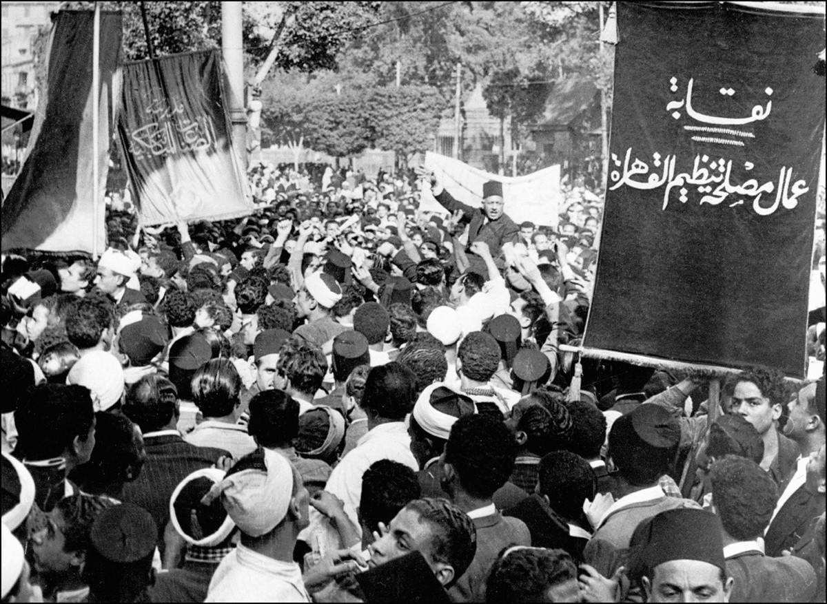 Picture dated 16 December 1947 shows president of the Young Men's Moslem Association, Saleh Harb Pasha (background C) carried on shoulders of some of his followers during a huge demonstration in  ...