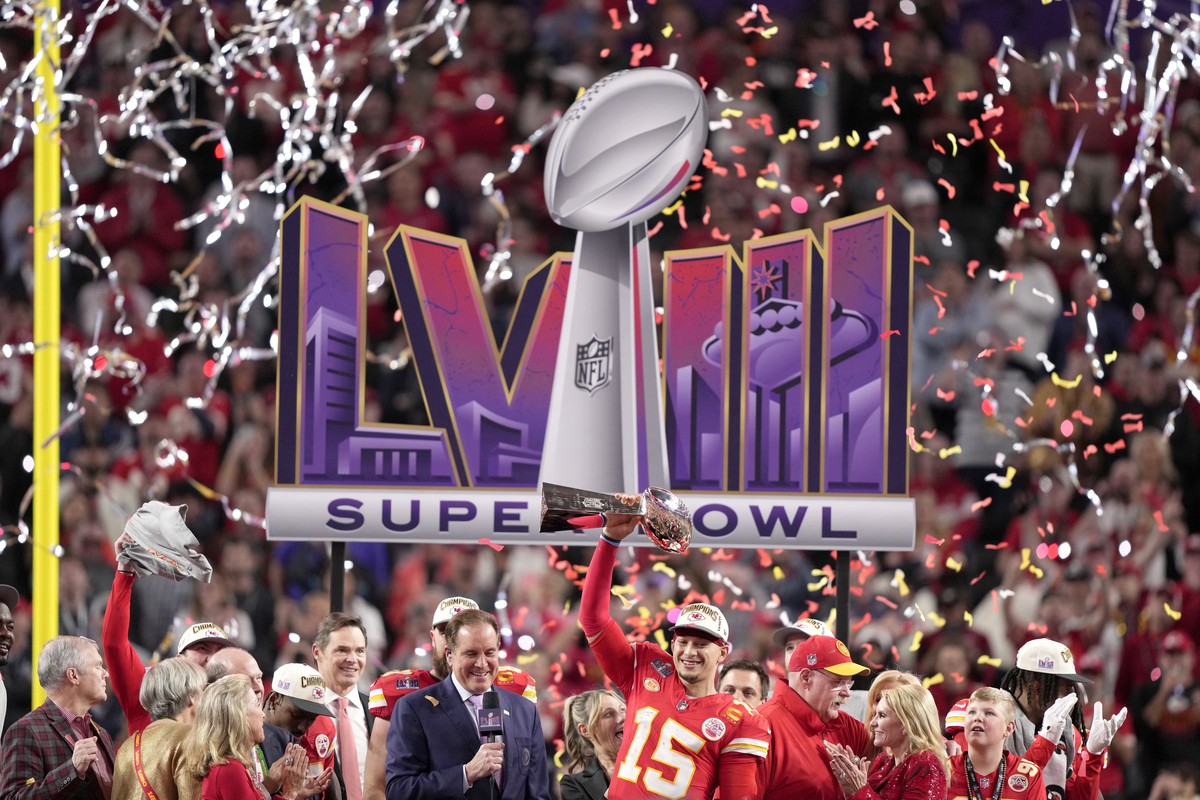 FILE - Kansas City Chiefs quarterback Patrick Mahomes raises the Lombardi Trophy over his head after defeating the San Francisco 49ers in NFL Super Bowl 58 football game Sunday, Feb. 11, 2024, in Las  ...