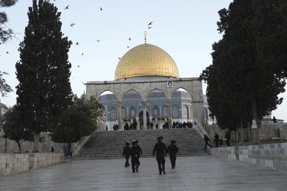 Israeli police are deployed at the Dome of the Rock Mosque in the Al-Aqsa Mosque compound following a raid at the site during the Muslim Holy month of Ramadan in the Old City of Jerusalem, Wednesday,  ...
