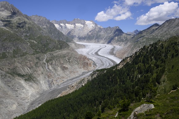 The Swiss Aletsch glacier, the longest glacier in Europe, pictured next to Riederalp, Switzerland, Monday, July 11, 2022. The Aletsch Glacier, a river of ice that stretches over 23 km from its formati ...