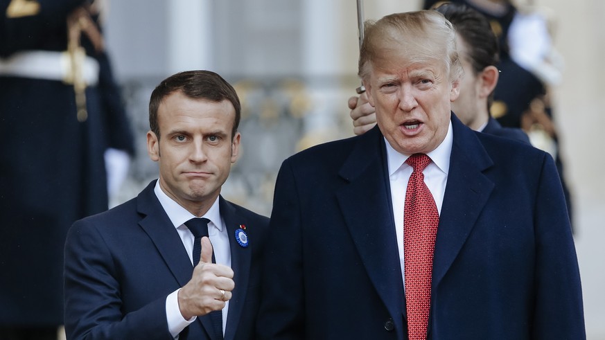 French President Emmanuel Macron, left, poses with President Donald Trump prior to their meeting at the Elysee presidential palace, in Paris, Saturday, Nov. 10, 2018. Trump is joining other world lead ...
