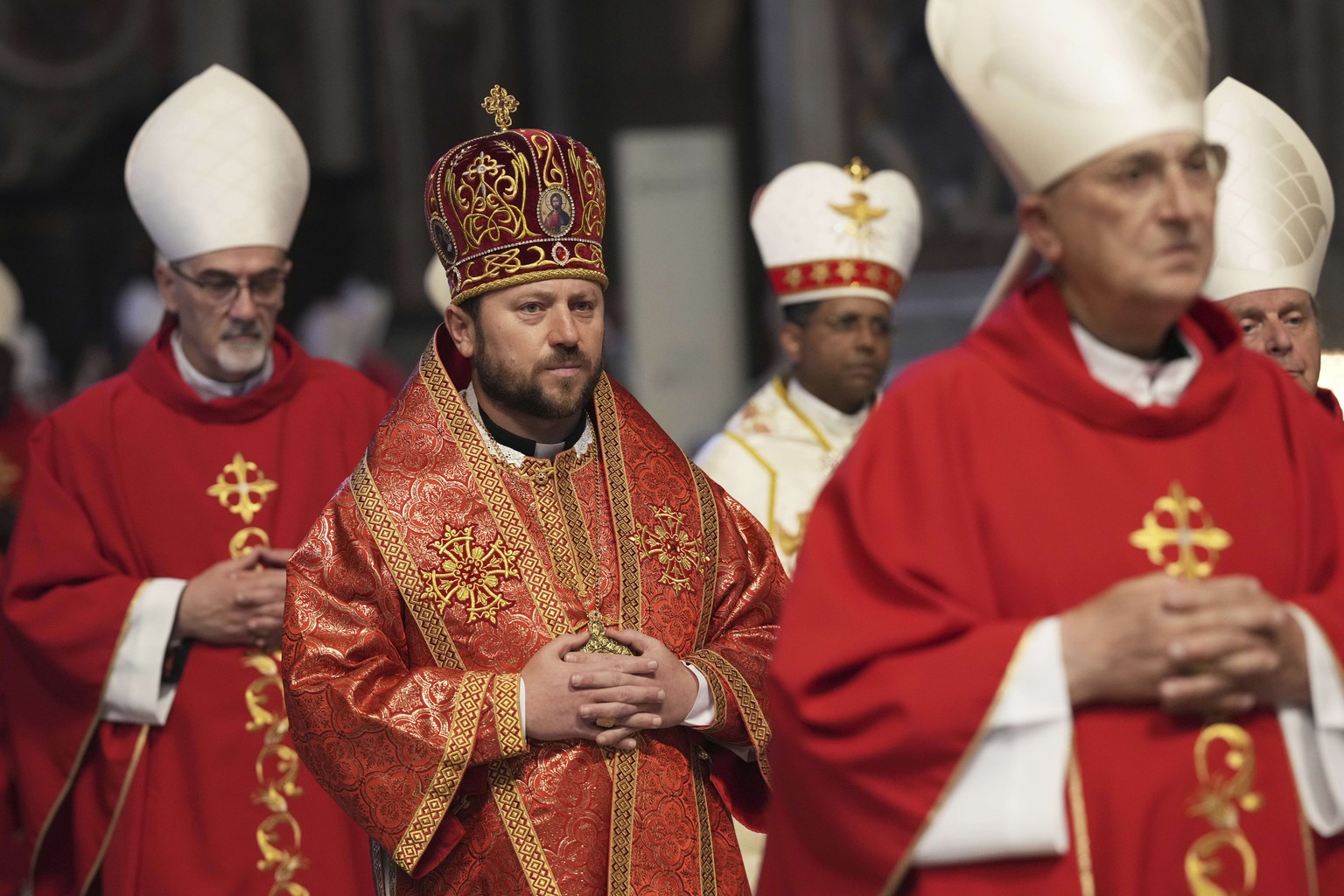Cardinal Mykola Bychok, second from left, arrives in procession for a mass on the seventh of nine days of mourning for late Pope Francis, in St. Peter&#039;s Basilica, at the Vatican, Friday, May 2, 2 ...