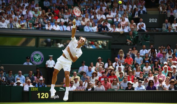 LONDON, ENGLAND - JULY 02: Roger Federer of Switzerland serves during his Gentlemens Singles Second Round match against Sam Querry of the United States during day four of the Wimbledon Lawn Tennis Cha ...