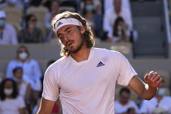 Stefanos Tsitsipas of Greece reacts as he plays Serbia&#039;s Novak Djokovic during their final match of the French Open tennis tournament at the Roland Garros stadium Sunday, June 13, 2021 in Paris.  ...