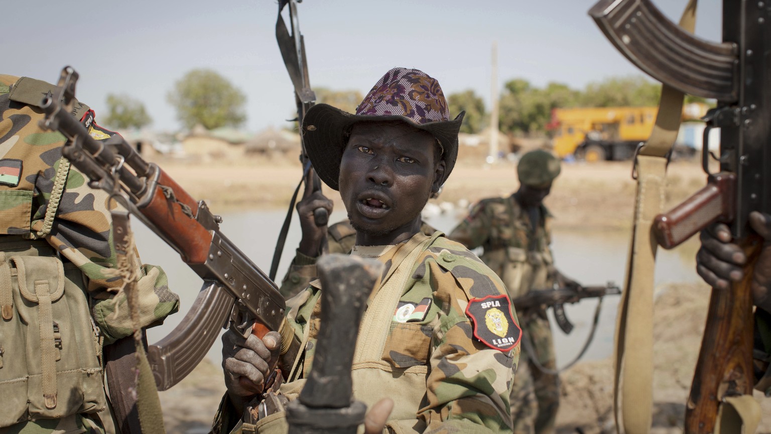FILE - In this Sunday, Jan 12, 2014 file photo, a South Sudanese government soldier chants in celebration after government forces two days earlier retook from rebel forces the provincial capital of Be ...
