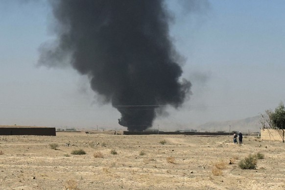 Smoke goes up after a shell exploded in a border area during clashes between Pakistan and Afghan forces, as seen from Pakistan side of the border near Chaman, Pakistan, Wednesday, Oct. 15, 2025. (AP P ...