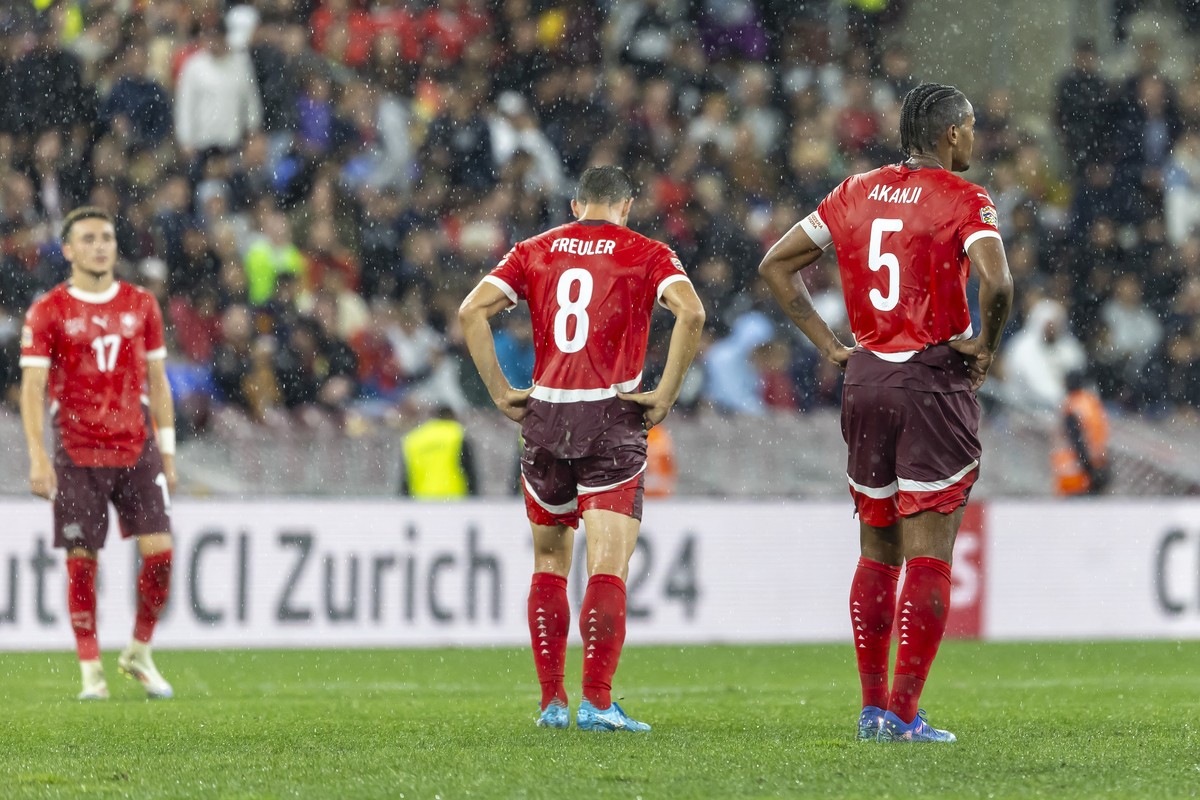 Switzerland's midfielder Ruben Vargas, left, Switzerland's midfielder Remo Freuler, centre, and Switzerland's defender Manuel Akanji, right, react after receiving their fourth goal, dur ...