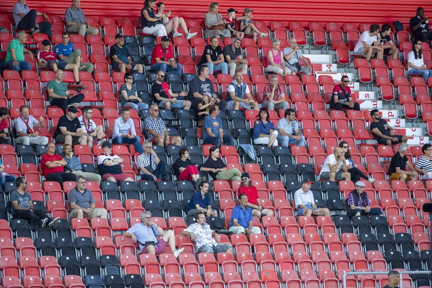 Spectators look the game, during the Super League soccer match of Swiss Championship between Neuchatel Xamax FCS and FC Basel, at the Stade de la Maladiere stadium, in Neuchatel, Switzerland, Wednesda ...