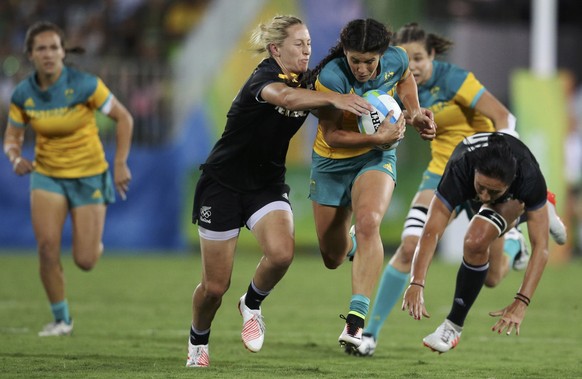 2016 Rio Olympics - Rugby - Women&#039;s Gold Medal Match Australia v New Zealand - Deodoro Stadium - Rio de Janeiro, Brazil - 08/08/2016. Kelly Brazier (NZL) of New Zealand and Sarah Goss (NZL) of Ne ...