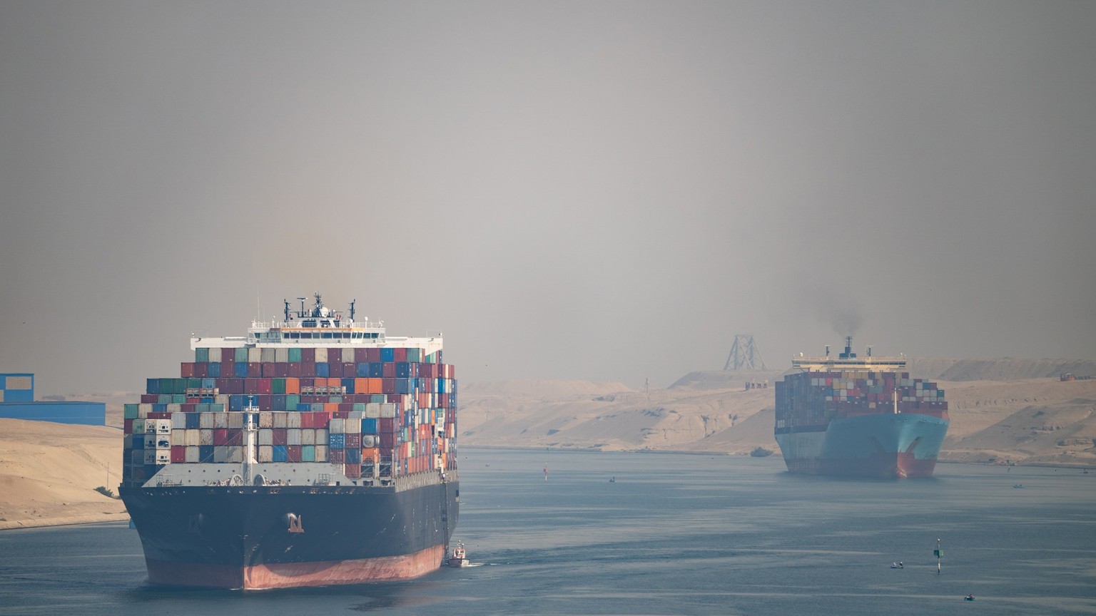 Many cargo ships navigate through Suez Canal. Shipping canal in Egypt. Concept of transportation and logistics. xkwx logistics, transportation, Suez canal, shipping, ship, suez, canal, cargo, logistic ...