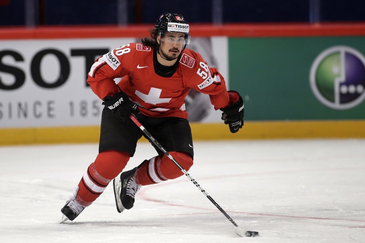 Switzerland's Eric Blum controls the puck, during the IIHF Ice Hockey World Championships preliminary round match Switzerland vs Canada at the Globe Arena in Stockholm, Sweden, on Sunday, 5 May 2 ...