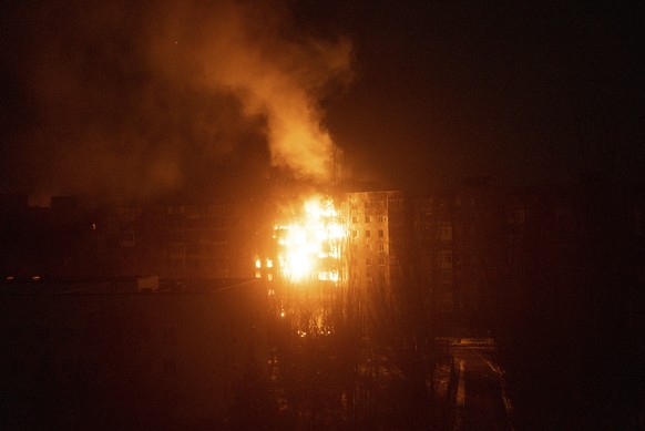 A fire burns at an apartment building after it was hit by shelling in Mariupol, Ukraine, Friday, March 11, 2022. (AP Photo/Mstyslav Chernov)