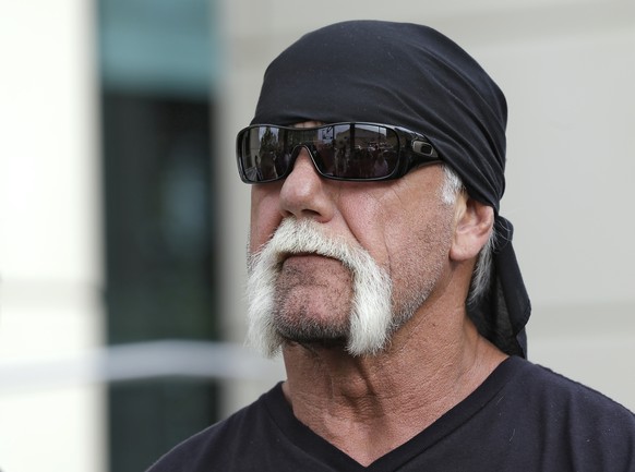 FILE - In this Oct. 15, 2012, file photo, reality TV star and former pro wrestler Hulk Hogan, whose real name is Terry Bollea, looks on as his attorney speaks during a news at the United States Courth ...