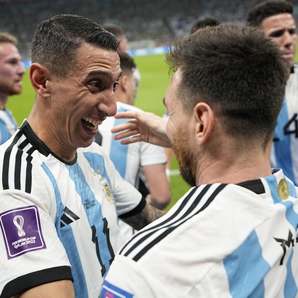 Argentina&#039;s Lionel Messi, right, celebrates with his teammate Angel Di Maria after scoring his side&#039;s opening goal during the World Cup group C soccer match between Argentina and Mexico, at  ...