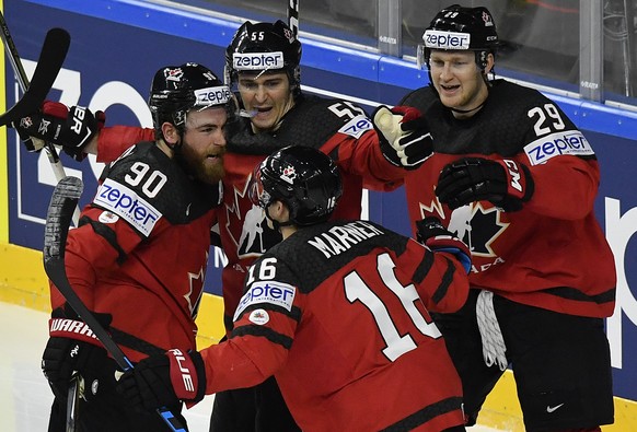 Canada&#039;s Ryan O&#039;Reilly, left, celebrates with teammates after scoring his side&#039;s first goal at the Ice Hockey World Championships final match between Canada and Sweden in the LANXESS ar ...