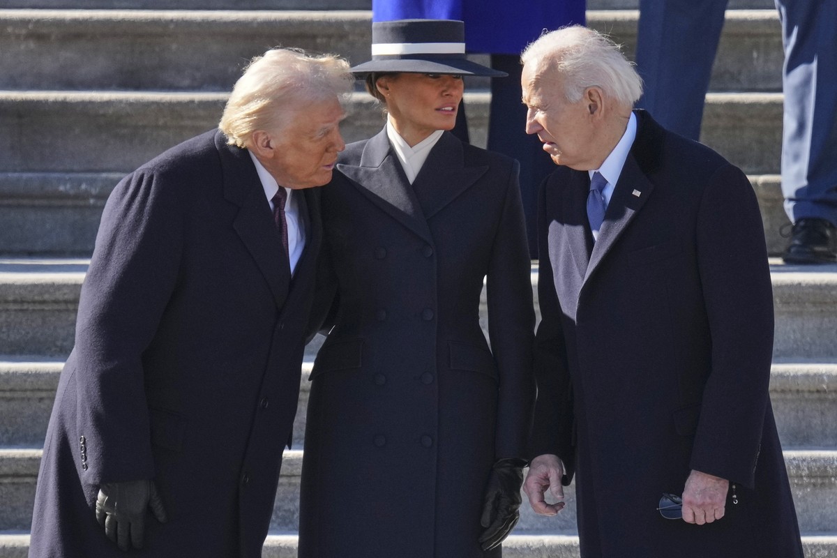 President Donald Trump, left, and first lady Melania Trump, center, speak with former President Joe Biden before the Bidens board a Marine helicopter to depart to Joint Base Andrews after the 60th Pre ...