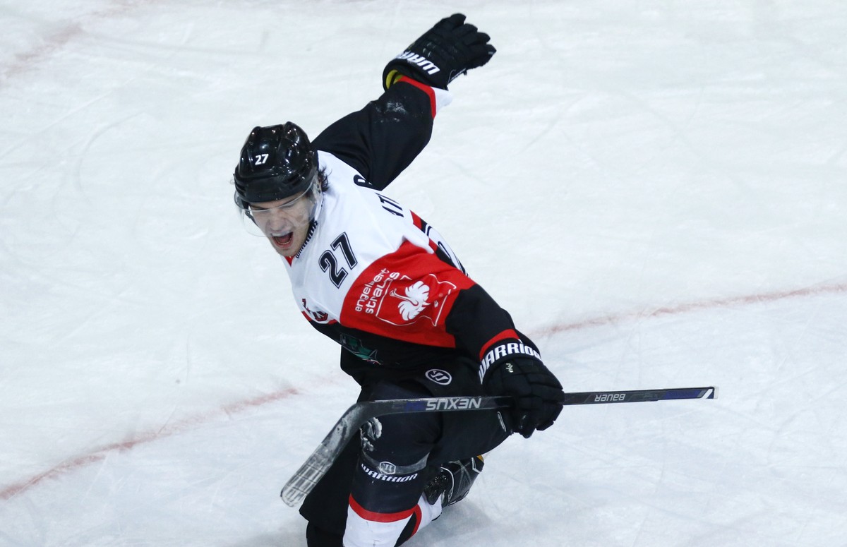 Fribourg's Yannick Rathgeb, celebrats his winning goal during the ice hockey Champions League match 1/8 Final between HC Fribourg-Gotteron and KalPa Kuopio of Finland, in Fribourg, Switzerland, T ...