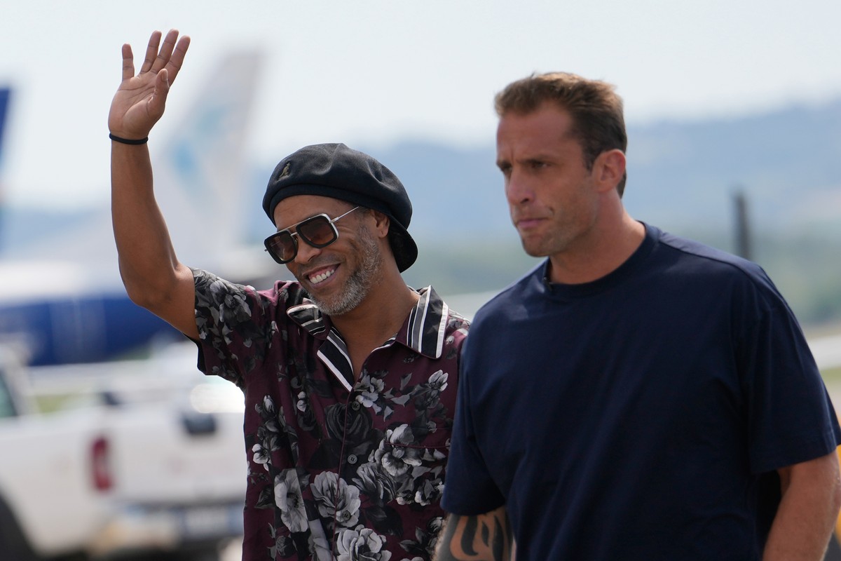 Former soccer star Ronaldinho, flanked by Ravenna president Igniazio Cipriani, right, arrives at the airport ahead the Ravenna Serie C, 2026 soccer team presentation, joining the club as a technical c ...