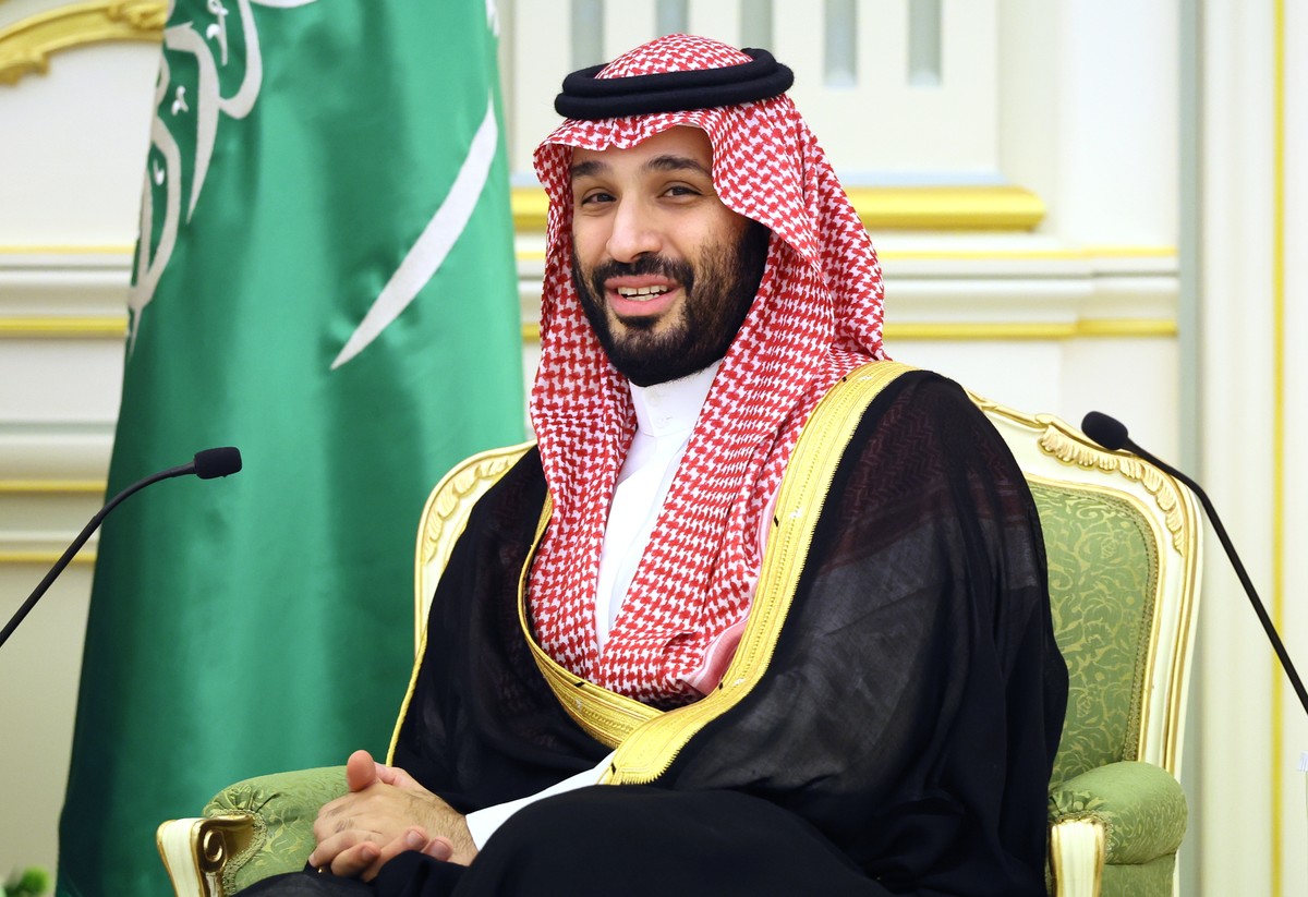 epa11014423 Saudi Arabian Crown Prince Mohammed bin Salman Al Saud smiles while speaking with Russian President Vladimir Putin, during their meeting at Al Yamamah Palace in Riyadh, Saudi Arabia, 06 De ...