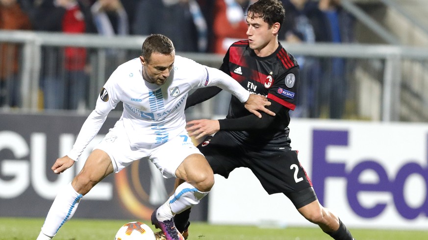 epa06374674 Milan&#039;s Davide Calabria i(R) vies for a ball with Mario Gavranovic (L) of NK Rijeka during the UEFA Europa League&#039; soccer match group D between NK Rijeka and AC Milan, Italy in R ...