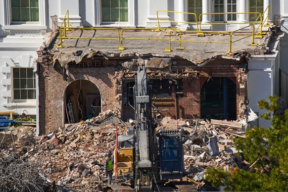 FILE - A worker walks among debris from a largely demolished part of the East Wing of the White House, Oct. 23, 2025, in Washington, before construction of a new ballroom. (AP Photo/Jacquelyn Martin)
 ...