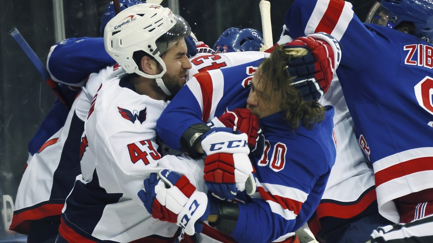 Washington Capitals&#039; Tom Wilson (43) takes a roughing penalty during the second period against New York Rangers&#039; Artemi Panarin (10) in an NHL hockey game Monday, May 3, 2021, in New York. ( ...