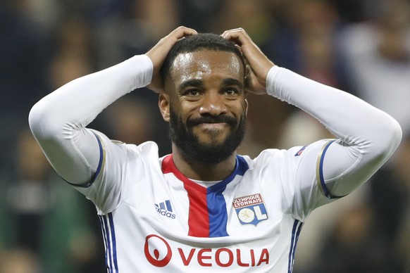 FILE - This is a Thursday, May 11, 2017 file photo, of Lyon&#039;s Alexandre Lacazette as he grabs his head after teammate Fakir missed a chance to score during the second leg semi final soccer match  ...