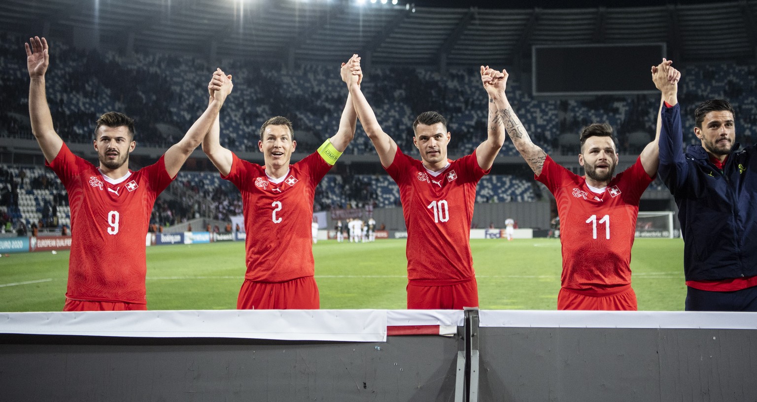 epa07458667 The team of Switzerland reacts after the UEFA Euro 2020 qualifier Group D soccer match between Georgia and Switzerland at the Boris Paichadze National Stadium in Tbilisi, Georgia, 23 March ...