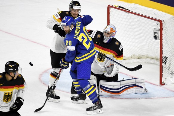 epa05947285 Sweden&#039;s forward Joel Lundqvist (C) in action against Germany&#039;s goalie Thomas Greiss (R) and Moritz Mueller (2-L) during the 2017 IIHF Ice Hockey World Championship group A preli ...