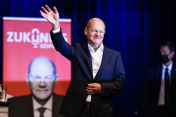 epa09417084 German Minister of Finance and Social Democratic Party (SPD) top candidate for the federal elections Olaf Scholz waves as he attends the event &#039;future talks&#039; in Berlin, Germany,  ...