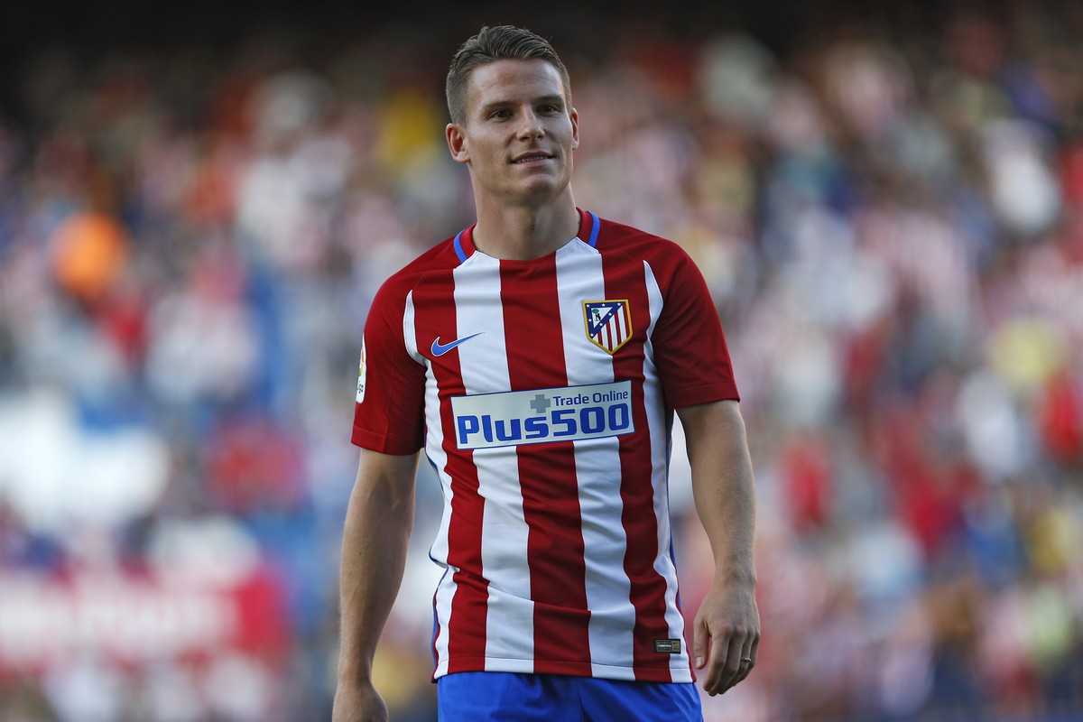 Atletico Madrid's new signing Kevin Gameiro walks along the pitch during his official presentation at the Vicente Calderon stadium in Madrid, Sunday, July 31, 2016. French striker Gameiro has sig ...