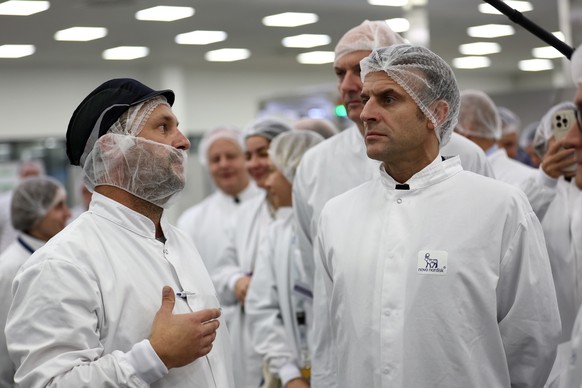 epa10991016 French President Emmanuel Macron (R) visits the plant of Danish pharmaceutical company Novo Nordisk in Chartres, France, 23 November 2023. Novo Nordisk employs over 2,000 persons in this p ...