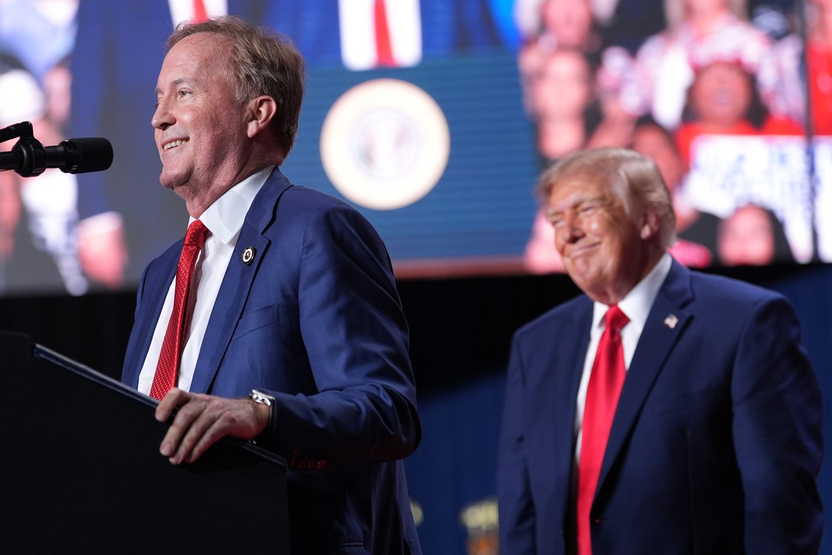 President Donald Trump listens as Republican U.S. Senate candidate Texas Attorney General Ken Paxton speaks at a campaign rally at the Freeman Coliseum in San Antonio, Wednesday, Oct. 7, 2026. (AP Pho ...