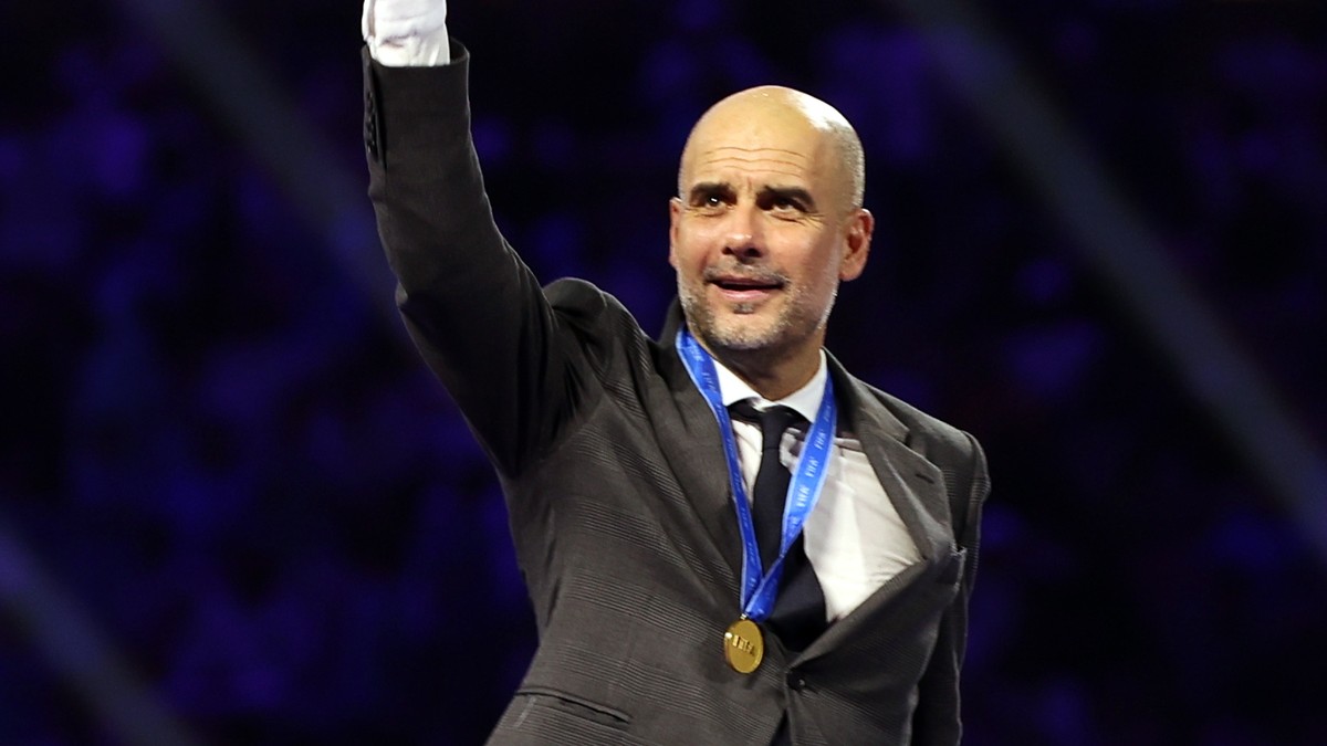 epa11041427 Manchester City's manager Pep Guardiola celebrates during the medal ceremony of the FIFA Club World Cup 2023 final match between Manchester City and Fluminense FC in Jeddah, Saudi Ara ...