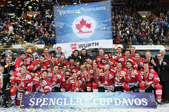 Players of Team Canada celebrater after winning the final game between Team Canada and Switzerlands HC Lugano at the 90th Spengler Cup ice hockey tournament in Davos, Switzerland, Saturday, December 3 ...