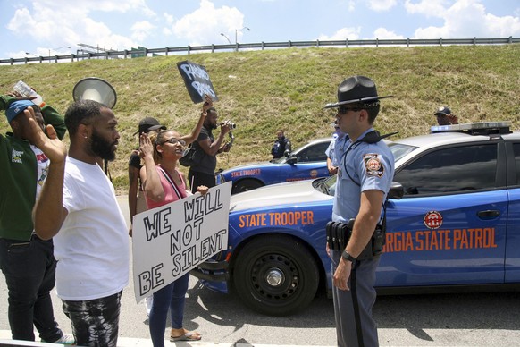 Protestors gather on University Ave near a Wendy&#039;s restaurant, Saturday, June 13, 2020 in Atlanta. Georgia authorities said Saturday a man was shot and killed in a late night struggle with Atlant ...