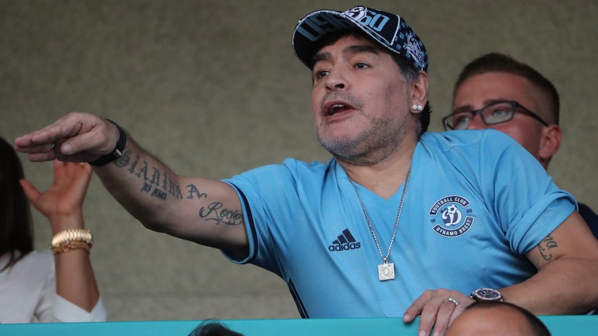 epa06893580 Former Argentinian soccer player Diego Maradona reacts during the soccer match between FC Dinamo Brest and FC Shakhtyor at the central stadium in Brest, Belarus, 16 July 2018. Maradona has ...