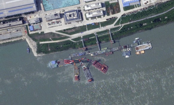 This satellite image from Planet Labs PBC shows what appears to be a sunken Chinese submarine at a shipyard near Wuhan, China, June 15, 2024. (Planet Labs PBC via AP)