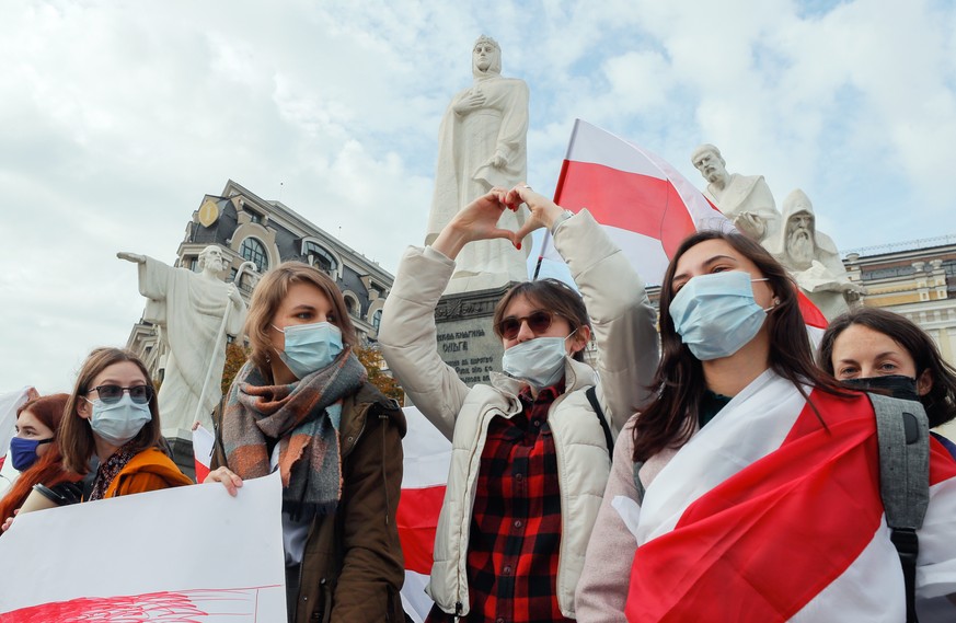 epa08770123 Belarusians living in Ukraine along with their supporters and Ukrainian activists attend a rally with the slogan &#039;March without flowers!&#039; in support of the Belarusian opposition  ...