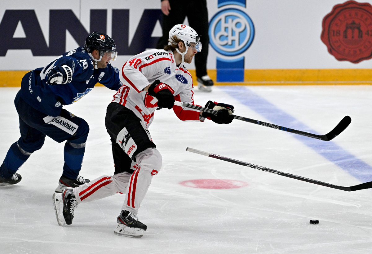 From left Teemu Hartikainen of FInland and Andre Heim of Switzerland in action during the Euro Hockey Challenge match Finland vs. Switzerland in Brno, Czech Republic, May 6, 2023. (CTKxPhoto/VaclavxSa ...