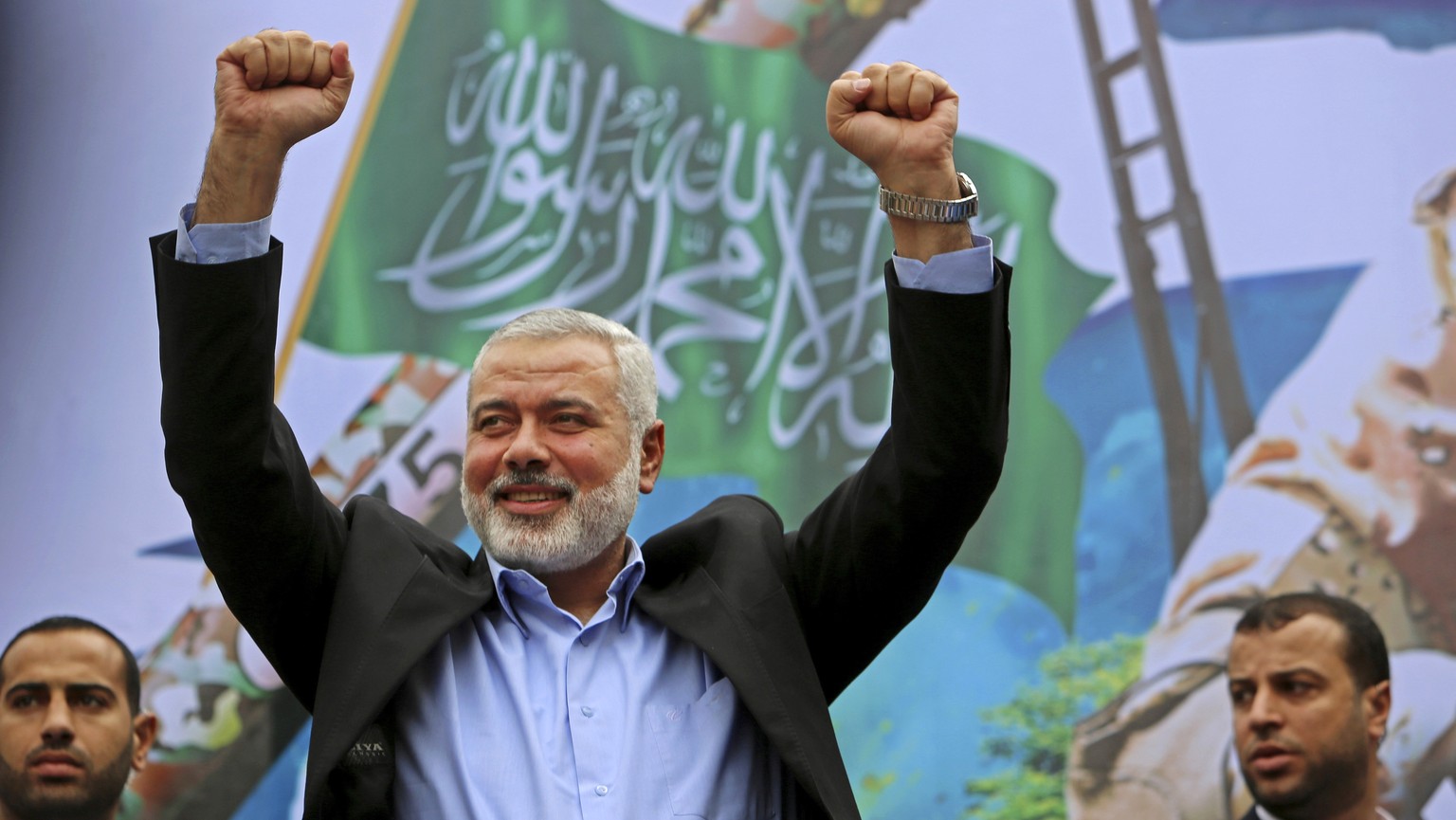 FILE - In this Friday, Dec. 12, 2014 file photo, Palestinian top Hamas leader Ismail Haniyeh greets supporters during a rally to commemorate the 27th anniversary of the Hamas militant group, at the ma ...