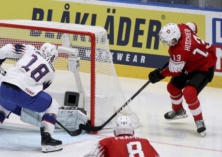 Swiss Nico Hischier, right, scores as Norway&#039;s Tobias Lindstrom, left, try to save during the Ice Hockey World Championships group B match between Switzerland and Norway at the Ondrej Nepela Aren ...