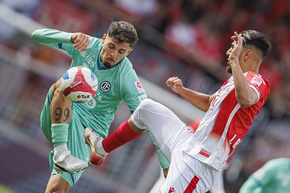 Uran Bislimi (LUG), gauche, lutte pour le ballon avec Ilyas Chouaref (SIO), droite, lors de la rencontre de football de Super League entre le FC Sion (SIO) et le FC Lugano (LUG) ce jeudi 14 mai 2026 a ...