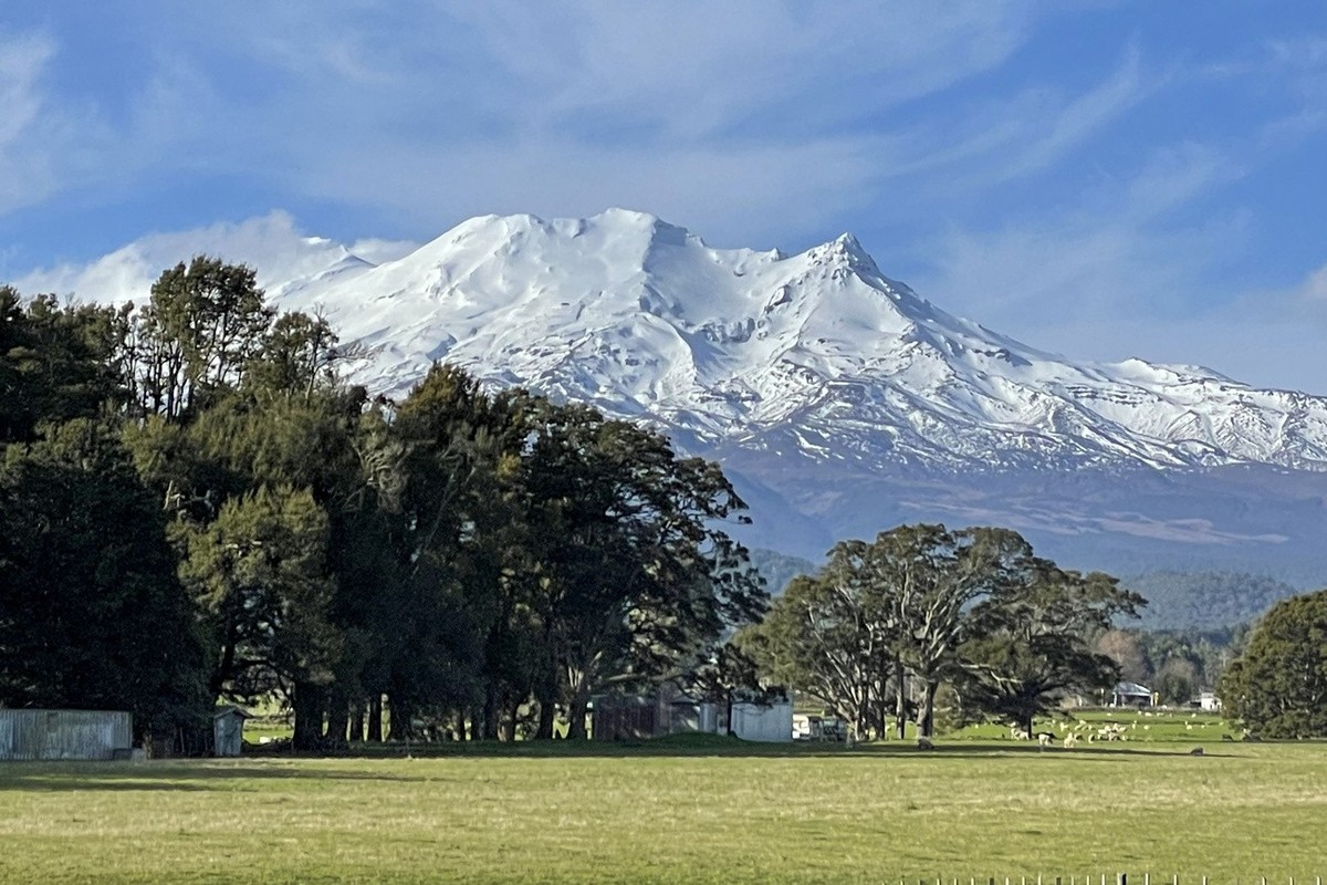 FILE - Snow covers the upper reaches of Mt. Ruapehu, an active volcano that film director Peter Jackson used as a backdrop in "The Lord of the Rings" movies, though no snow is on the ground  ...