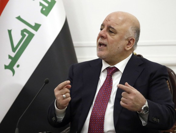 Iraqi Prime Minister Haider al-Abadi talks during his meeting with U.S. Secretary of State Rex Tillerson, Monday, Oct. 23, 2017, in Baghdad, Iraq. Tillerson made an unannounced trip to Iraq Monday, ju ...