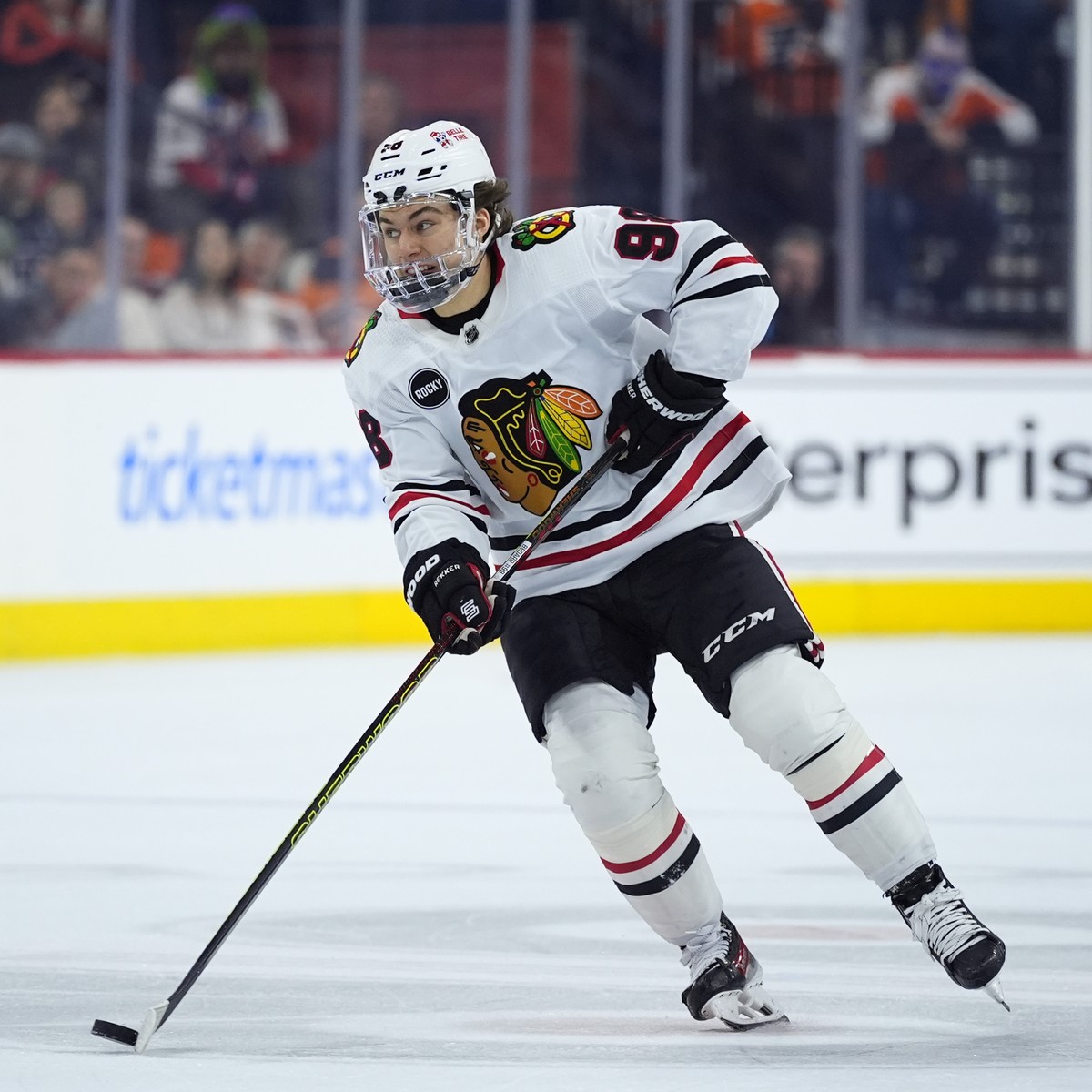 Chicago Blackhawks' Connor Bedard skates with the puck during the first period of an NHL hockey game against the Philadelphia Flyers, Saturday, March 30, 2024, in Philadelphia. (AP Photo/Matt Slo ...